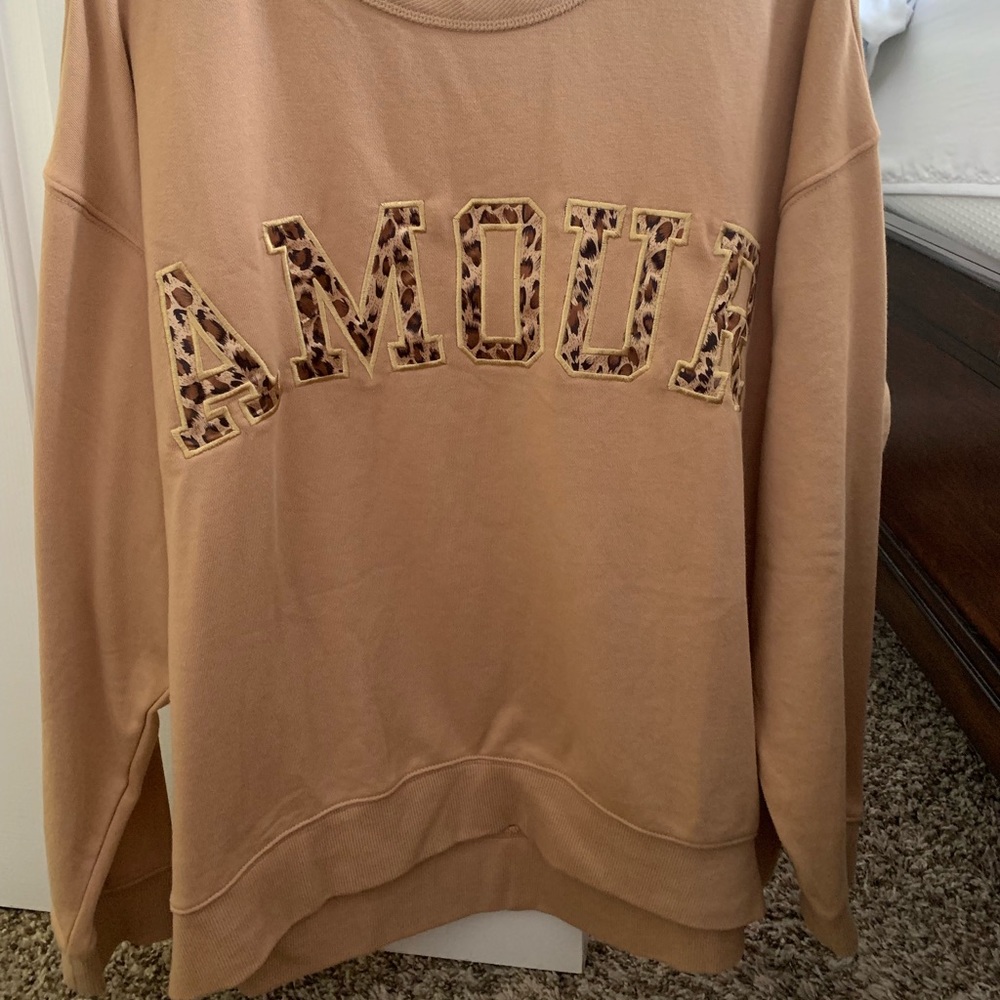 Crew neck sweater.
